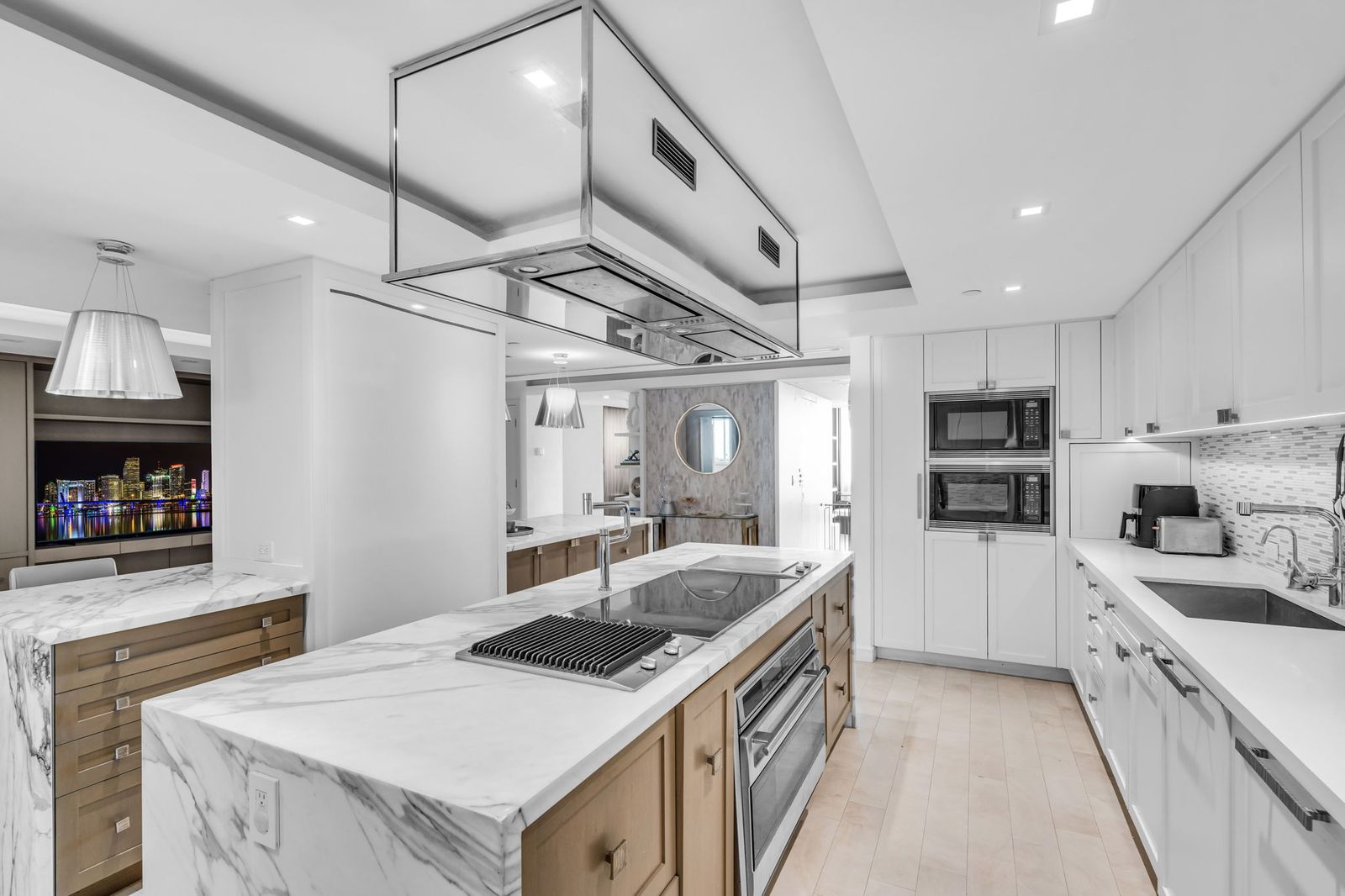 Island cooktop and integrated hood
