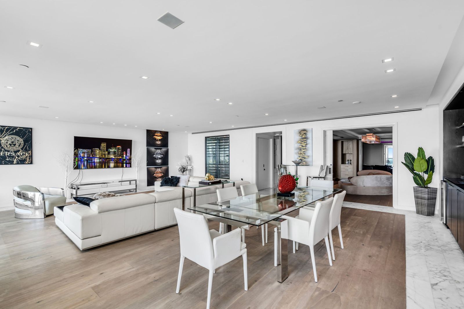 Open living and dining room with floor-to-ceiling windows